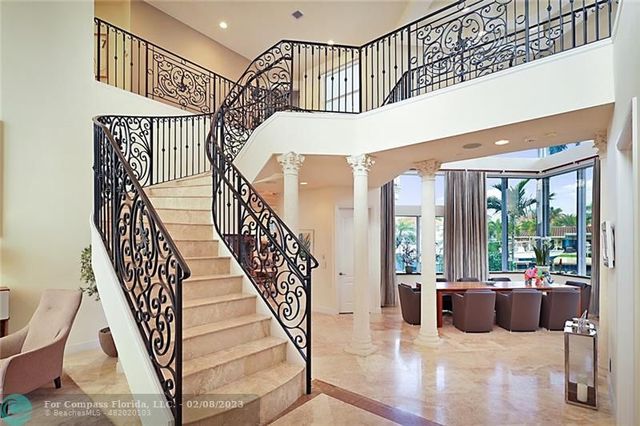 a view of entryway livingroom and hall with wooden floor