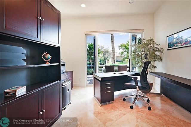 a view of workspace with a window and sitting area