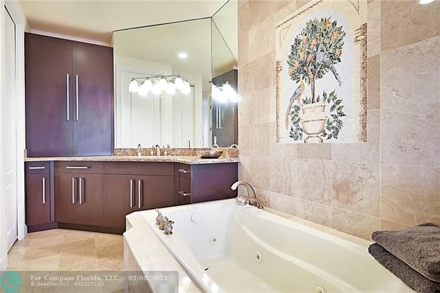 a bathroom with a bathtub and a sink