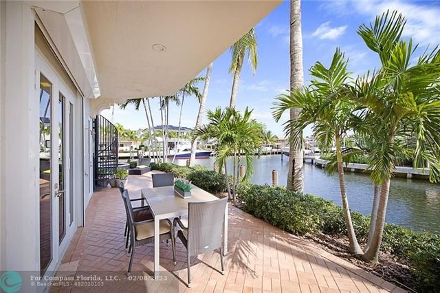 a view of a chairs and table in a patio