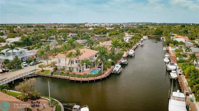 an aerial view of a house with a lake view
