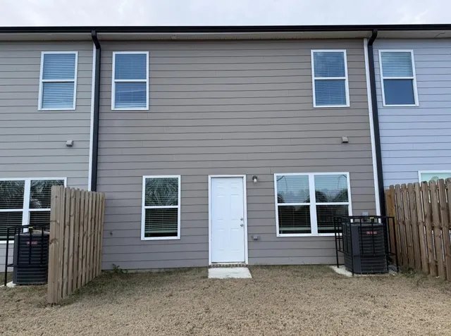 a view of front door and a window