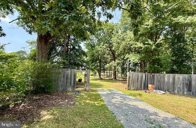 a view of a yard with swimming pool