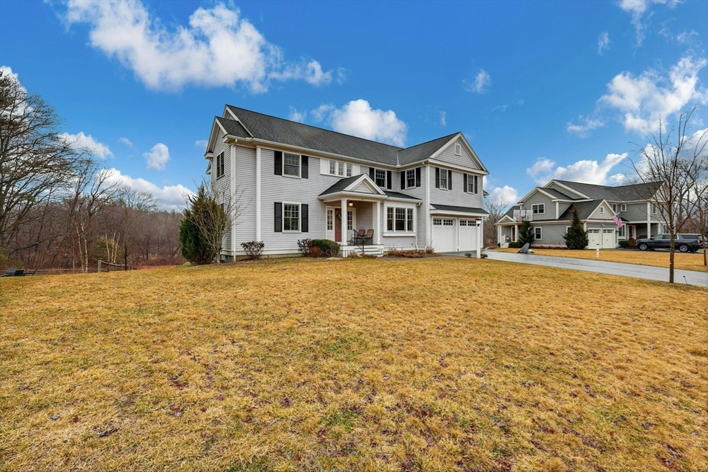 271 Monsen Road Concord, MA 01742 - Photo 3 of 42 a front view of a house with a yard