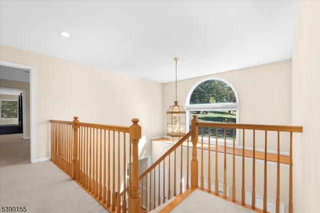 a view of a hallway with windows