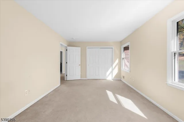 a view of empty room with windows