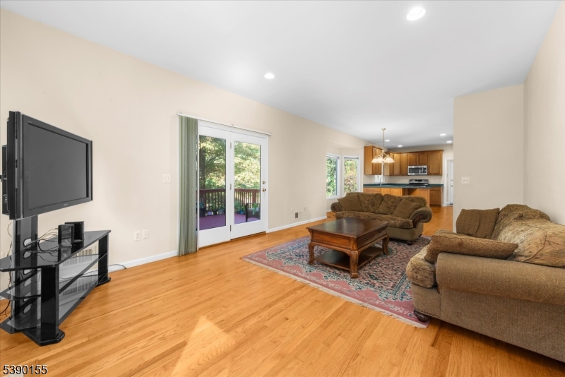 5 Sky View Garden Road Lebanon, NJ 08833 - Photo 10 of 42 a living room with furniture and a flat screen tv