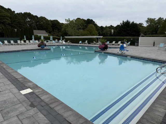 a view of swimming pool with chairs