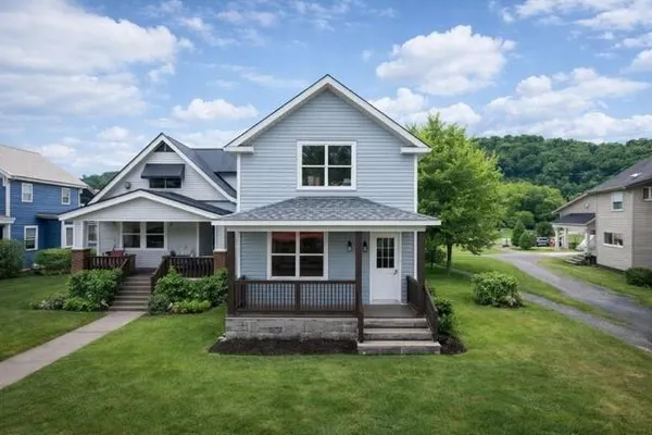 a front view of a house with a yard