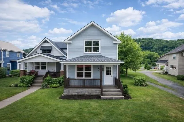 a front view of a house with a yard