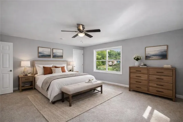 an empty room with chandelier fan