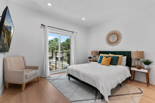 a bedroom with a bed and a couch