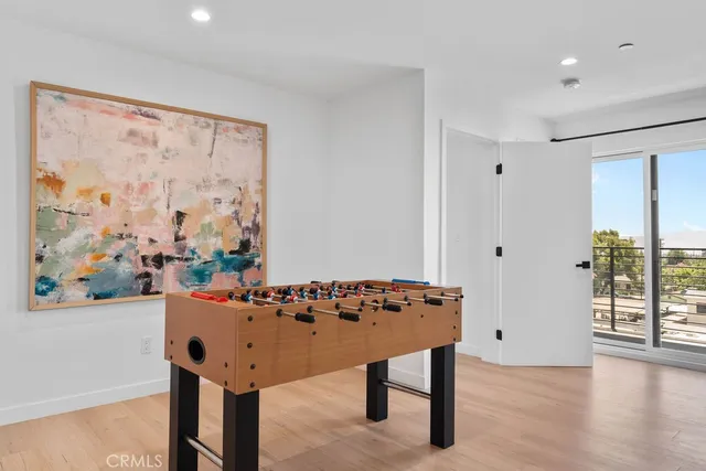 a bedroom with a bed and a night stand