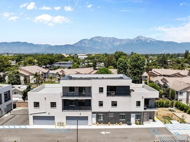 an aerial view of a house with a lake view