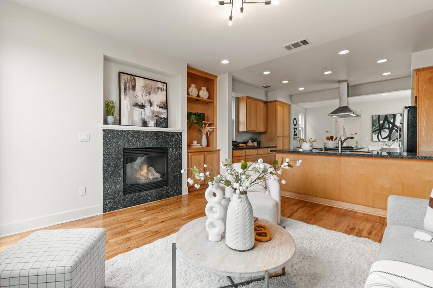 221 Bayberry Circle Pacifica, CA 94044 - Photo 23 of 63 a living room with a couch and a fireplace