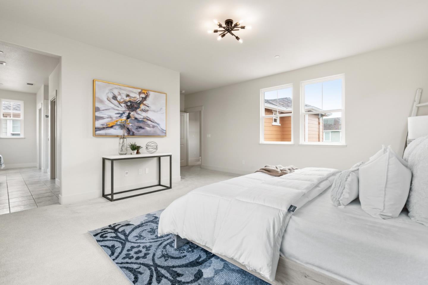 221 Bayberry Circle Pacifica, CA 94044 - Photo 32 of 63 a bedroom with a bed and a painting on the wall