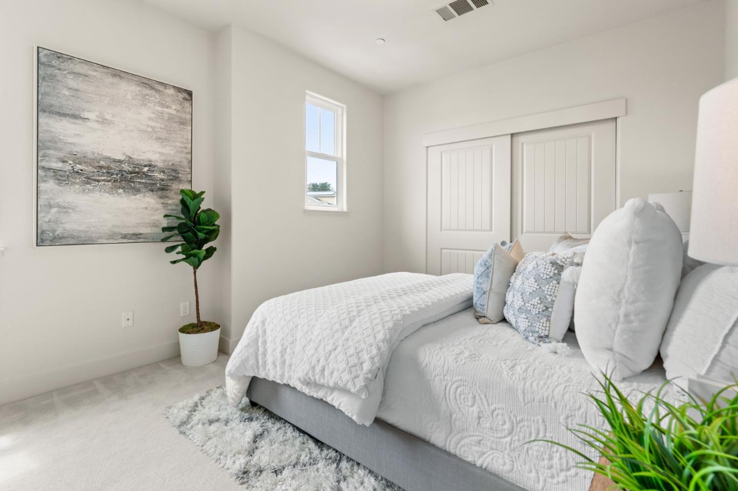 221 Bayberry Circle Pacifica, CA 94044 - Photo 41 of 63 a bedroom with a bed and a potted plant