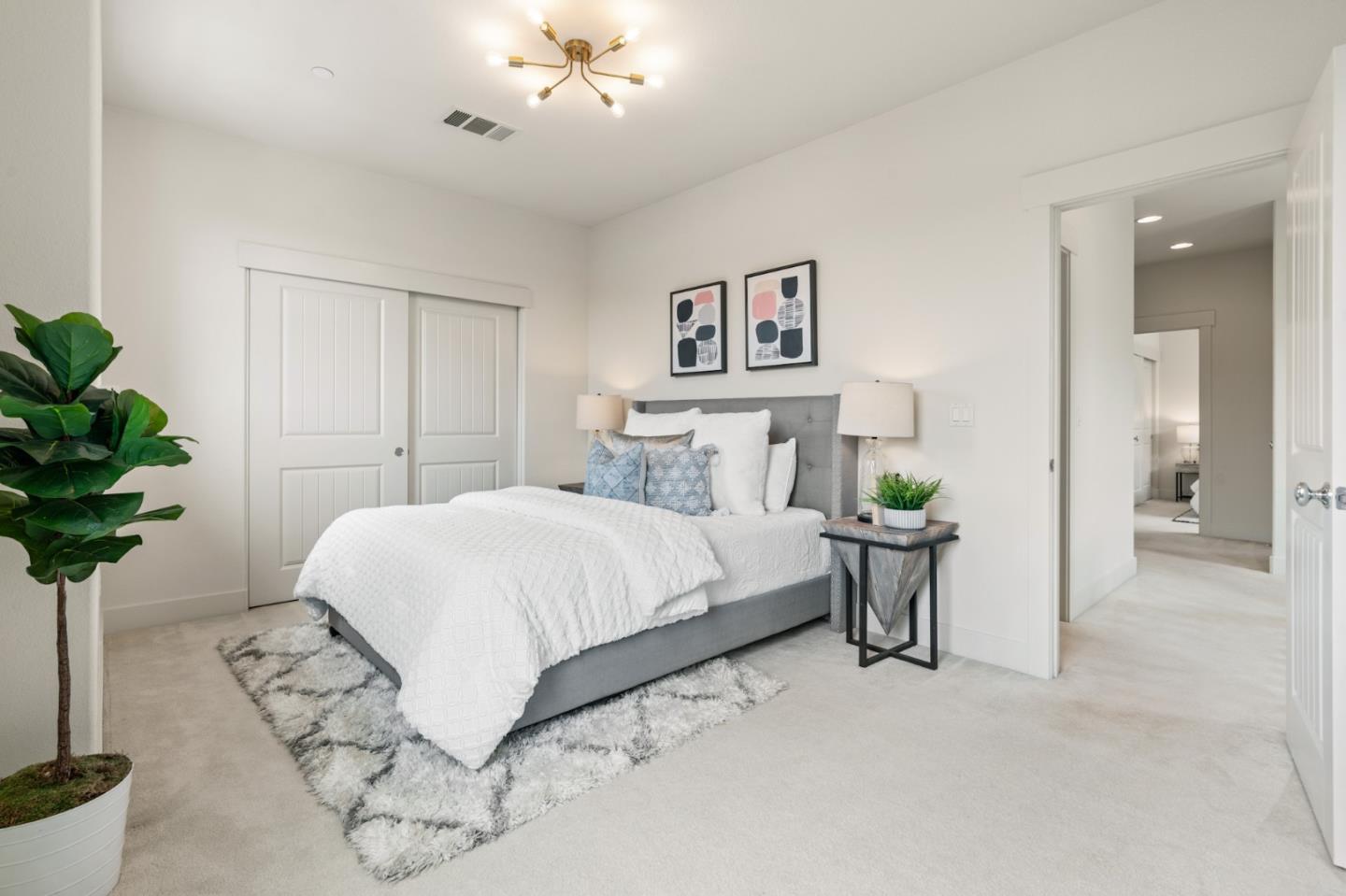 221 Bayberry Circle Pacifica, CA 94044 - Photo 42 of 63 a bedroom with a bed and a potted plant