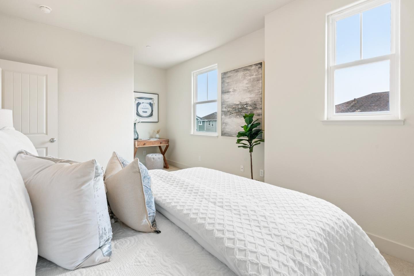 221 Bayberry Circle Pacifica, CA 94044 - Photo 45 of 63 a bedroom with a bed and a potted plant