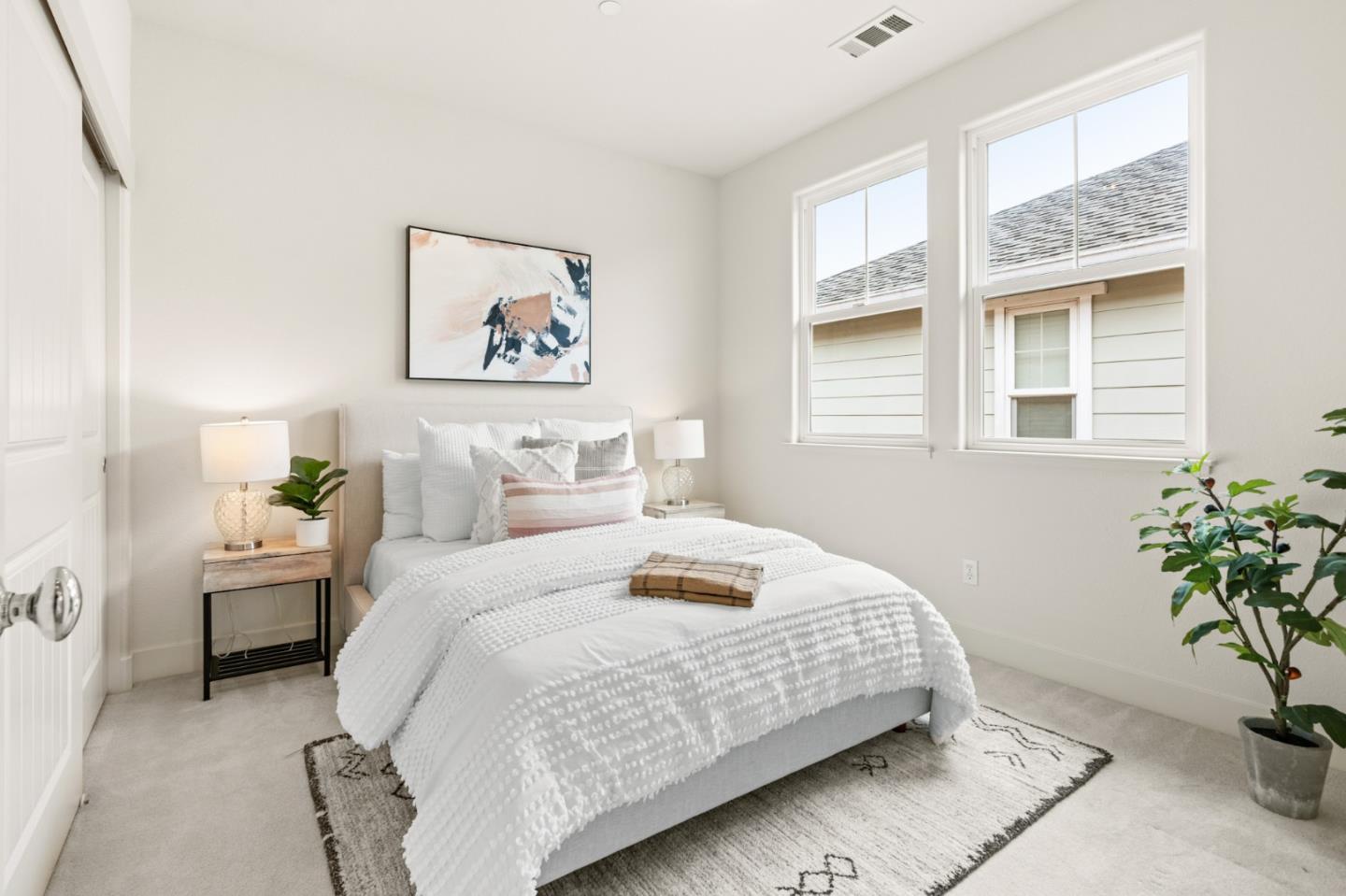 221 Bayberry Circle Pacifica, CA 94044 - Photo 47 of 63 a bedroom with a bed and a potted plant