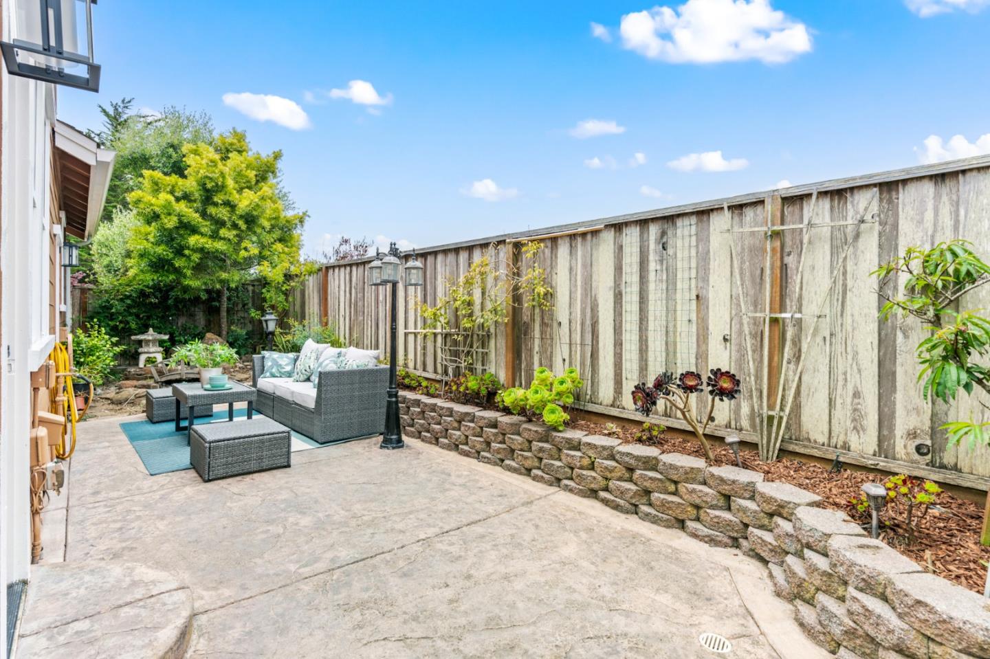 221 Bayberry Circle Pacifica, CA 94044 - Photo 52 of 63 a garden view with a sitting space