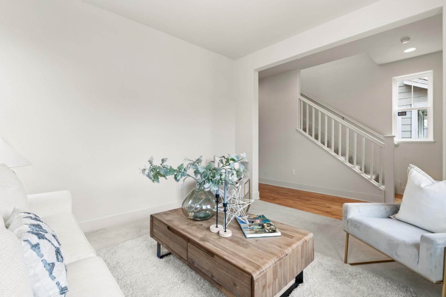 221 Bayberry Circle Pacifica, CA 94044 - Photo 7 of 63 a living room with furniture potted plant and wooden floor
