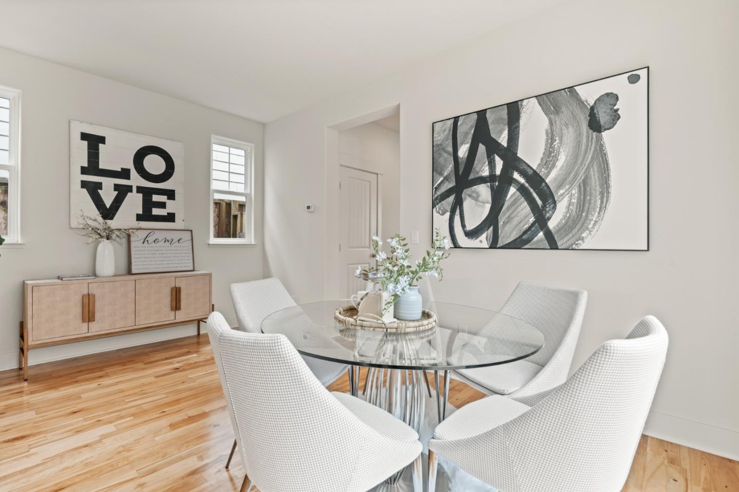 221 Bayberry Circle Pacifica, CA 94044 - Photo 10 of 63 a view of a dining room with furniture and wooden floor