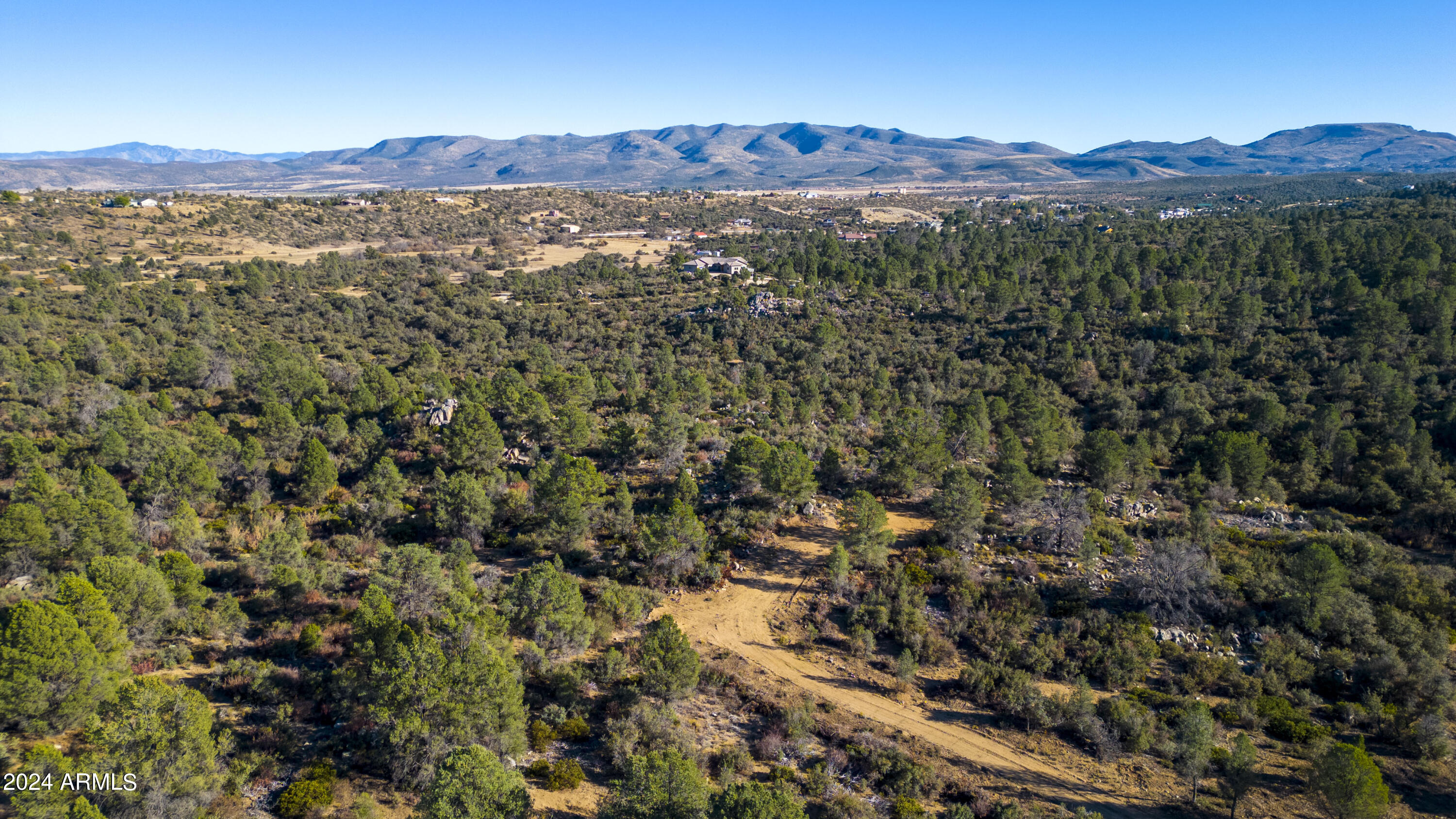 4 Blue Sky Drive, Unit D Peeples Valley, AZ 86332 - Photo 10 of 25 a view of a mountain in the distance in a field