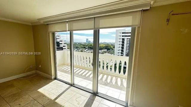 a view of a glass door and the balcony