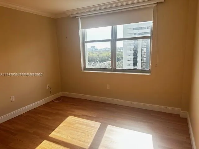 a view of an empty room with a window