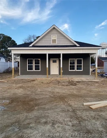 a front view of a house with a porch