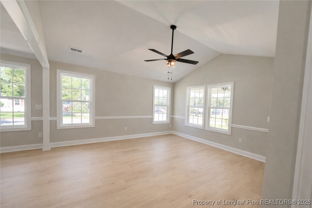 804 Holmes Street Clinton, NC 28328 - Photo 3 of 7 a view of an empty room with a window
