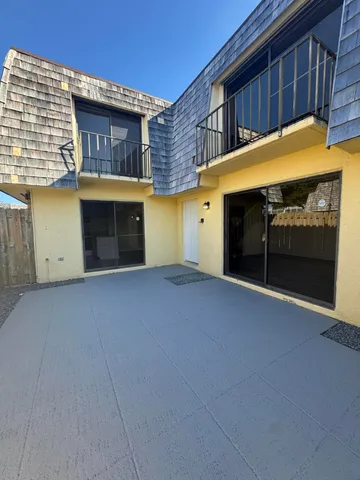 a view of an empty room with a fireplace
