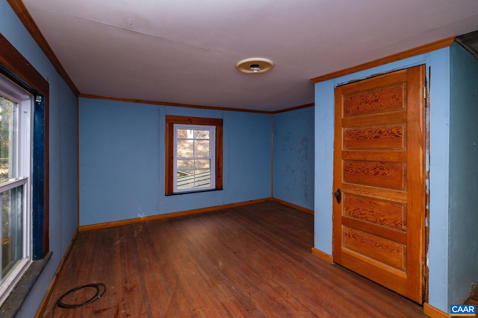 37 Pharsalia Road Roseland, VA 22967 - Photo 14 of 59 an empty room with wooden floor closet and windows