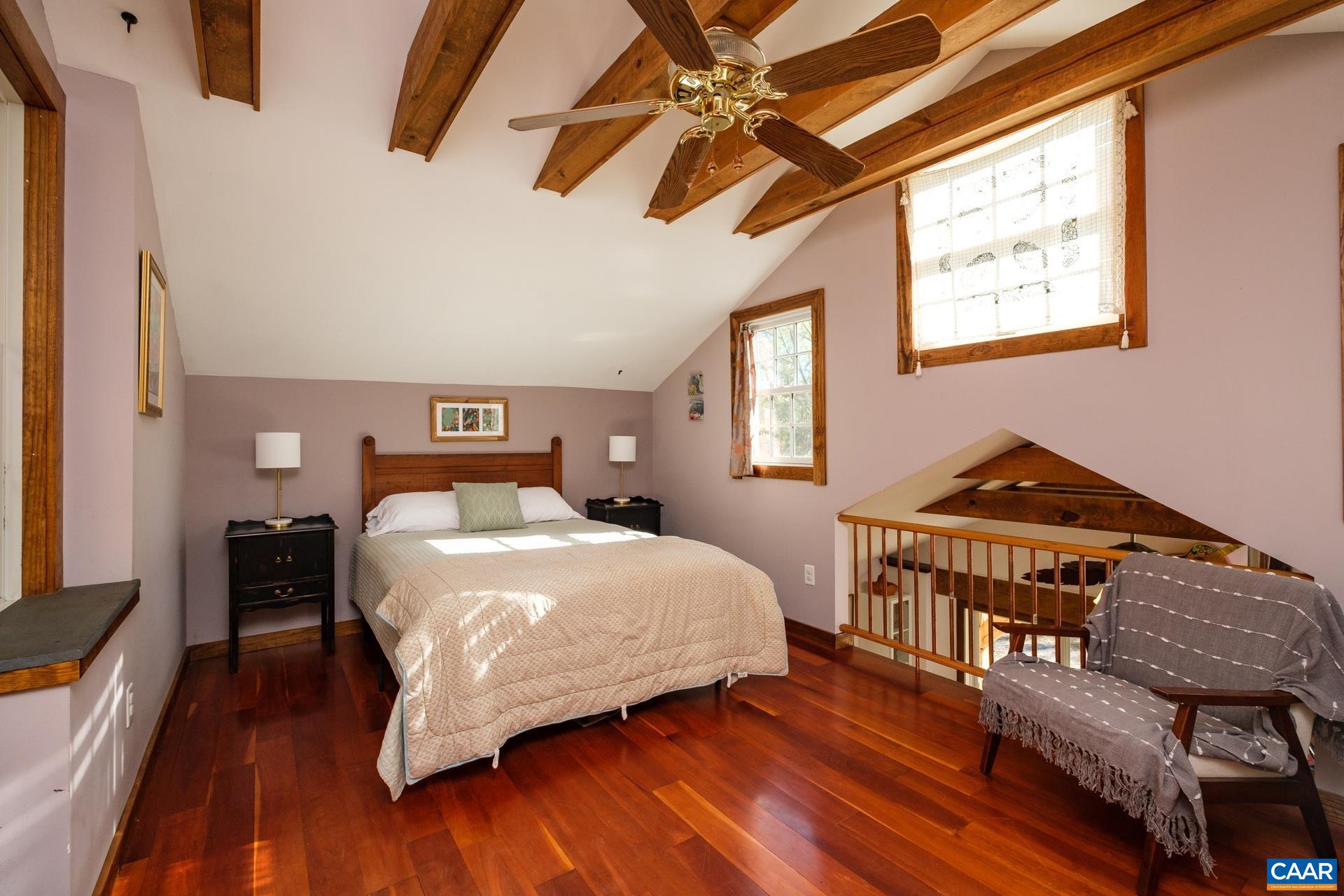 37 Pharsalia Road Roseland, VA 22967 - Photo 33 of 59 a bedroom with a bed bookshelf and a window