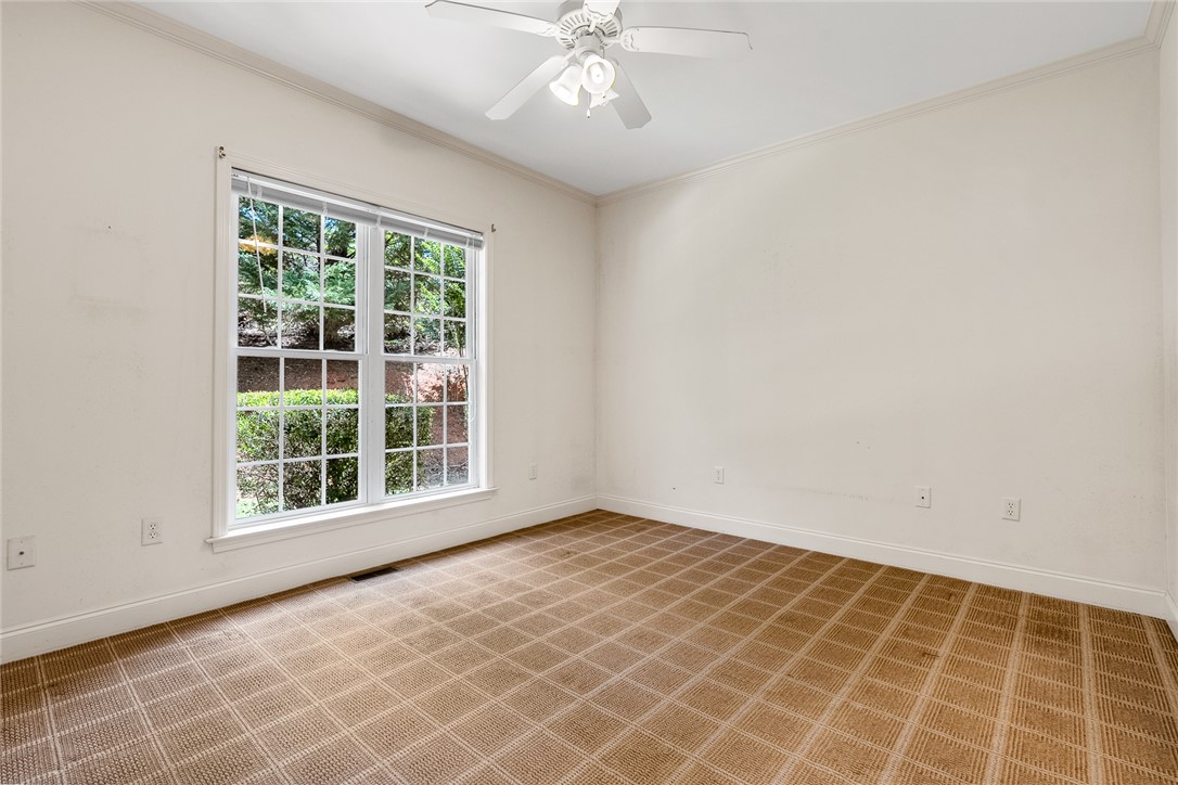 135 Sunset Bay Boulevard Seneca, SC 29672 - Photo 31 of 50 A windowed space with wall-to-wall carpeting and a bright overhead light.
