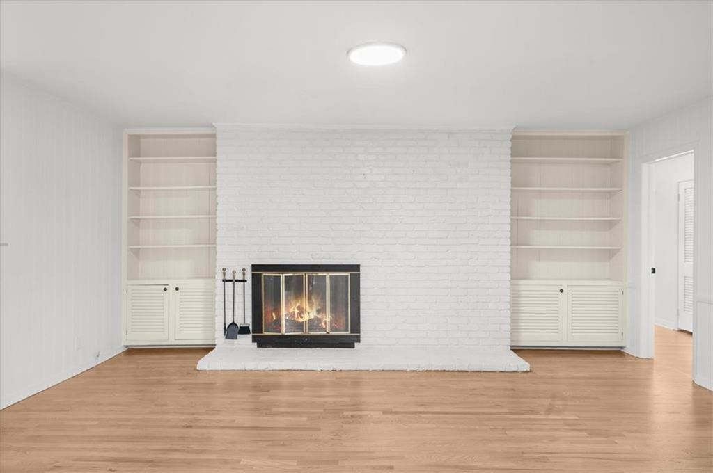 4890 High Point Road Northeast Sandy Springs, GA 30342 - Photo 14 of 35 a view of a room with wooden floor and closet