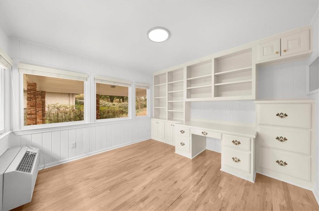 4890 High Point Road Northeast Sandy Springs, GA 30342 - Photo 16 of 35 a view of wooden floor and windows in a kitchen