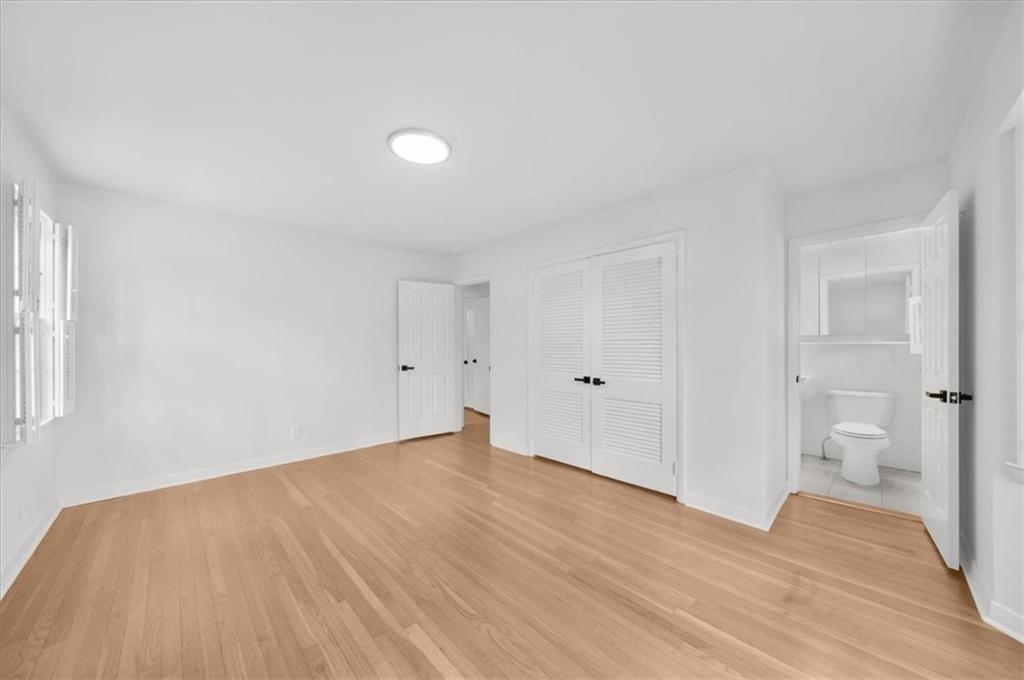 4890 High Point Road Northeast Sandy Springs, GA 30342 - Photo 24 of 35 a view of empty room with wooden floor