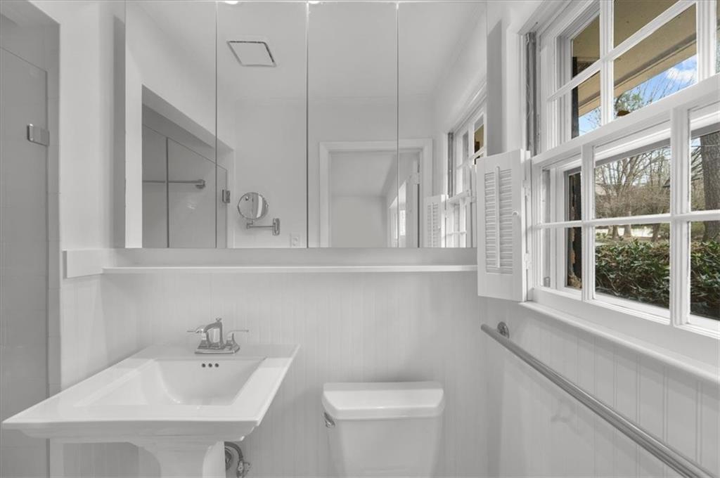 4890 High Point Road Northeast Sandy Springs, GA 30342 - Photo 26 of 35 a bathroom with a sink and a toilet