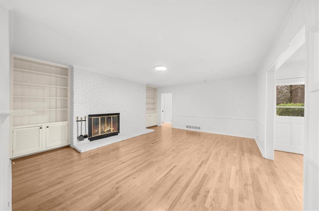 4890 High Point Road Northeast Sandy Springs, GA 30342 - Photo 29 of 35 a view of empty room with wooden floor and fan