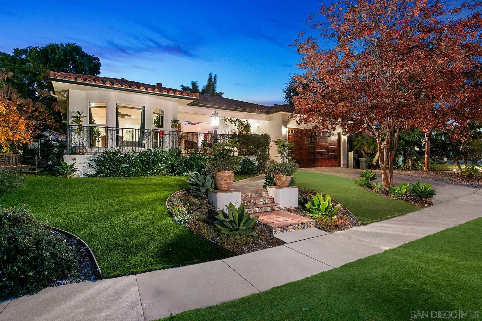 4195 Rochester Road San Diego, CA 92116 - Photo 1 of 39 a front view of a house with garden and trees
