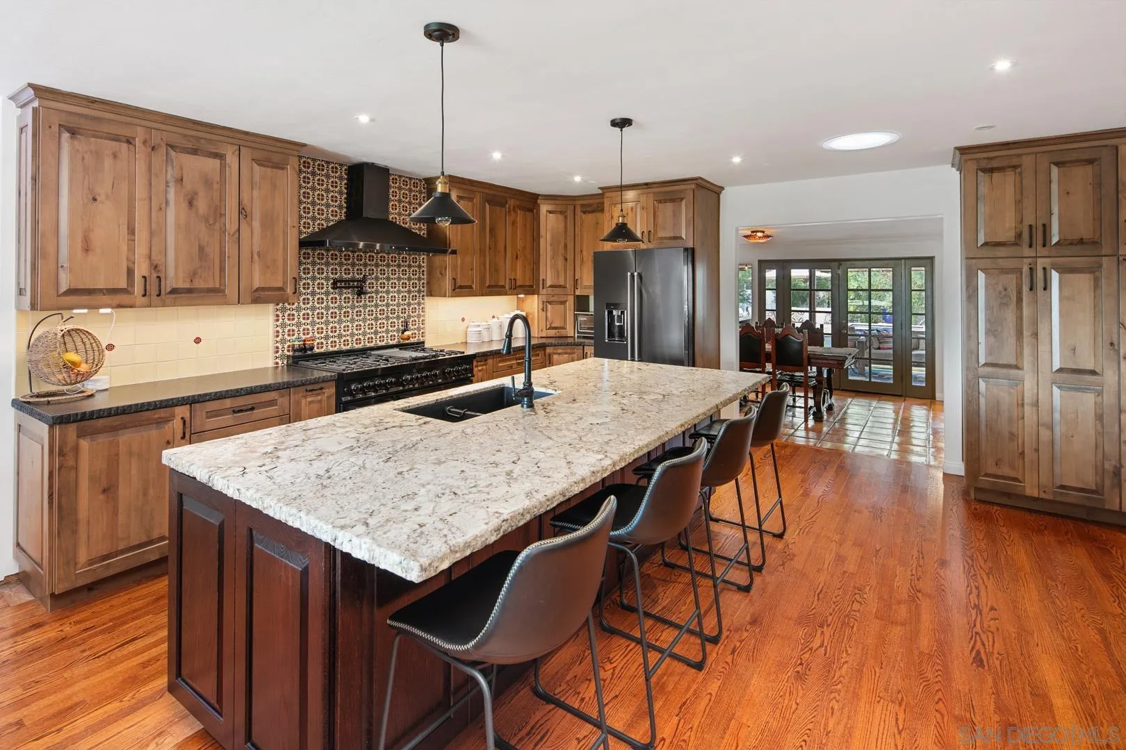 4195 Rochester Road San Diego, CA 92116 - Photo 17 of 39 an open kitchen with a table and chairs in it
