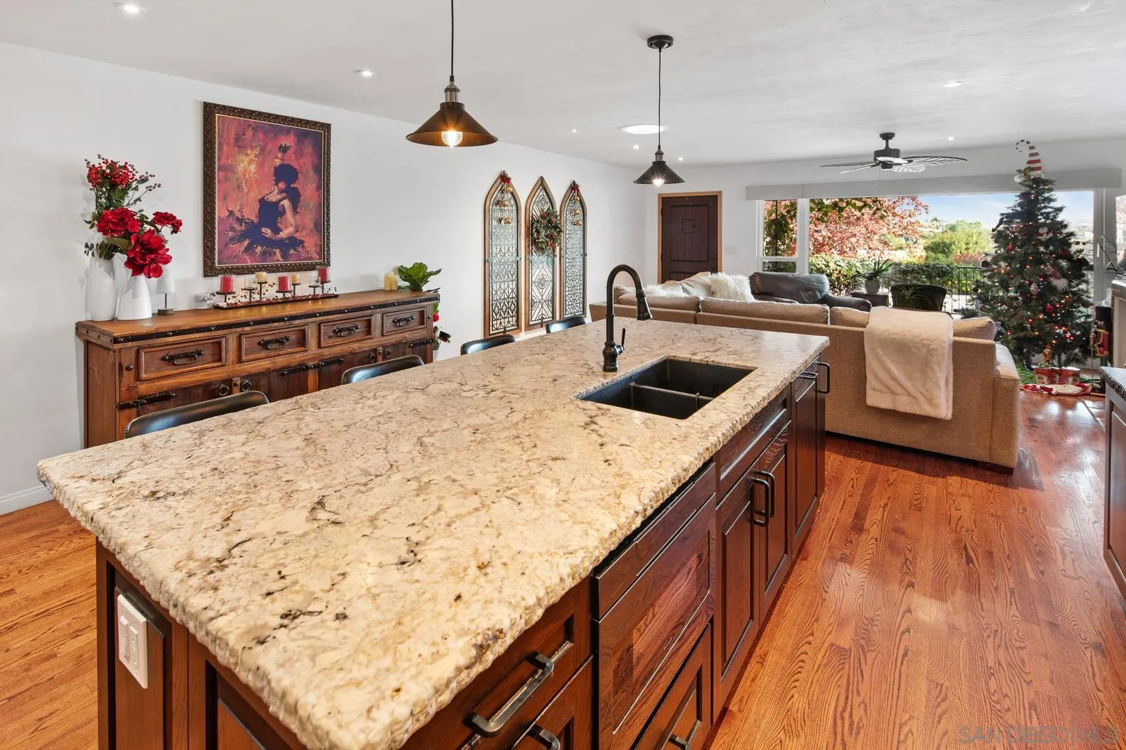 4195 Rochester Road San Diego, CA 92116 - Photo 20 of 39 a kitchen with stainless steel appliances granite countertop a sink dishwasher and a stove with wooden floor