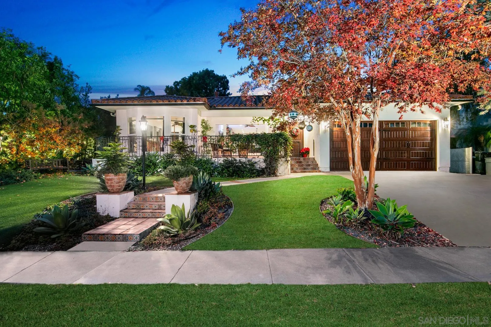 4195 Rochester Road San Diego, CA 92116 - Photo 2 of 39 a view of a house with a yard and potted plants