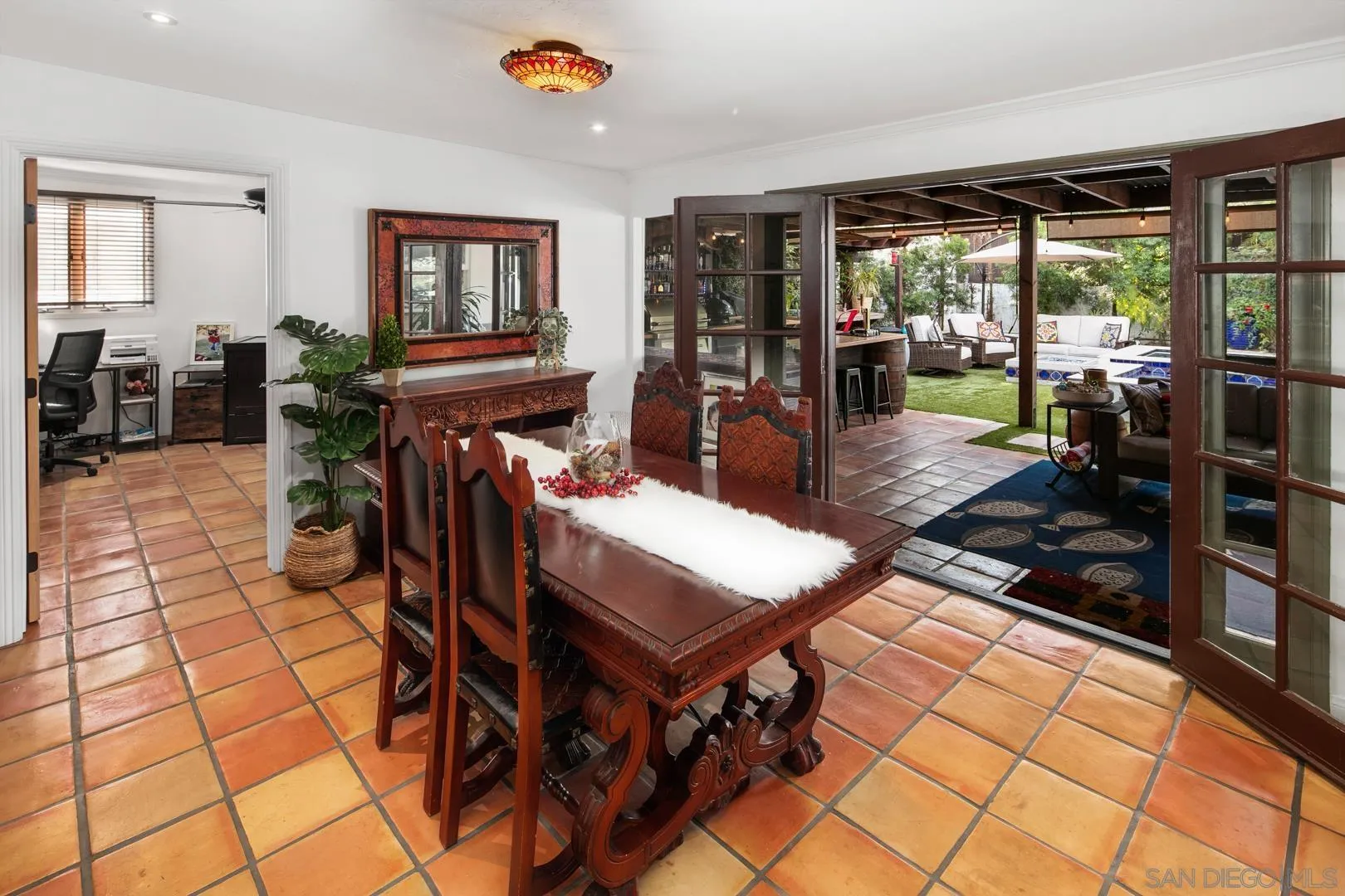 4195 Rochester Road San Diego, CA 92116 - Photo 23 of 39 a living room with patio furniture and a floor to ceiling window