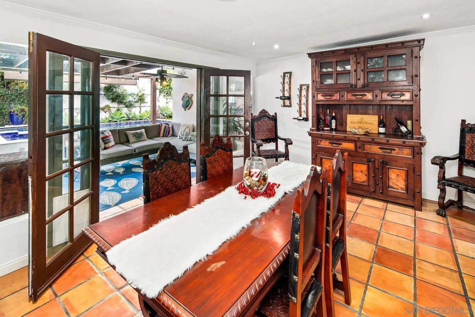 4195 Rochester Road San Diego, CA 92116 - Photo 24 of 39 a living room with furniture a flat screen tv and a floor to ceiling window
