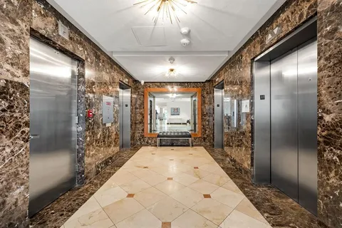 a view of a swimming pool with a lounge chairs
