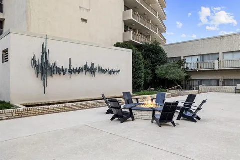a view of swimming pool with outdoor seating