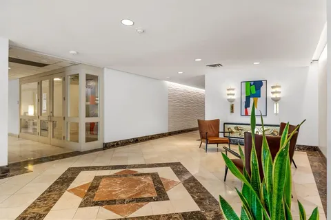 a bathroom with a shower and a sink
